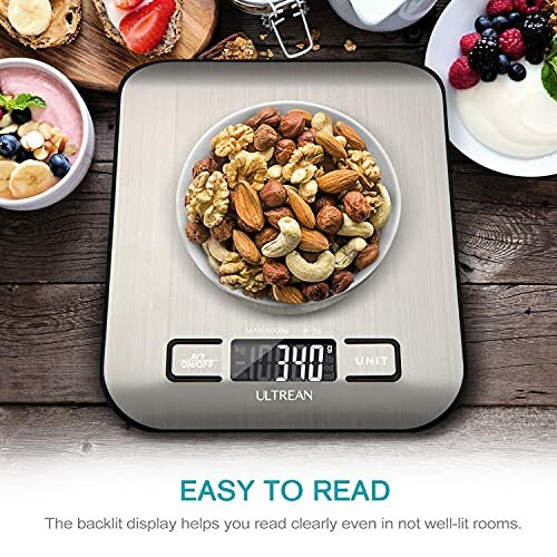 Digital kitchen scale displaying a bowl of assorted nuts.