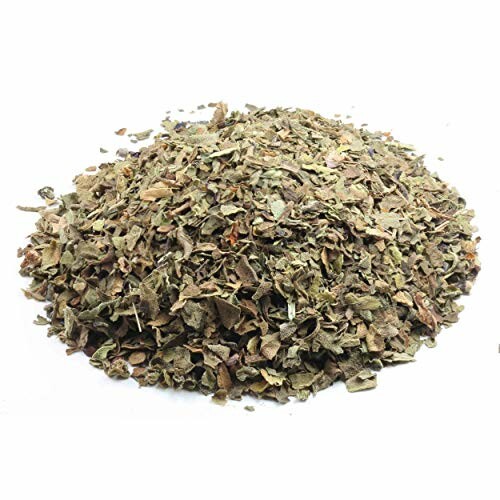 Pile of dried herbs on white background.