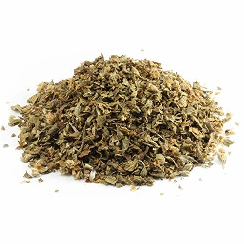 Pile of dried herbs on a white background.