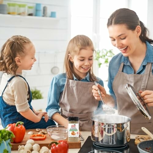 Mother and daughters cooking in kitchen with spices.