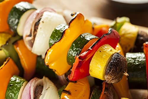 Colorful grilled vegetable skewers with peppers and zucchini.