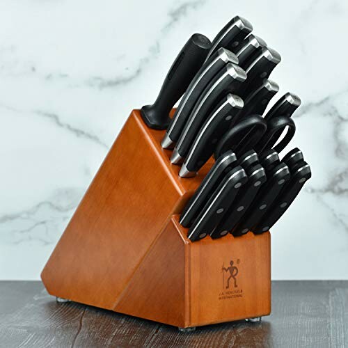 Wooden knife block set with multiple knives on a countertop