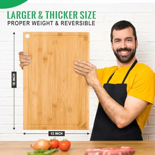 Man holding large bamboo cutting board with dimensions 18x12 inches.